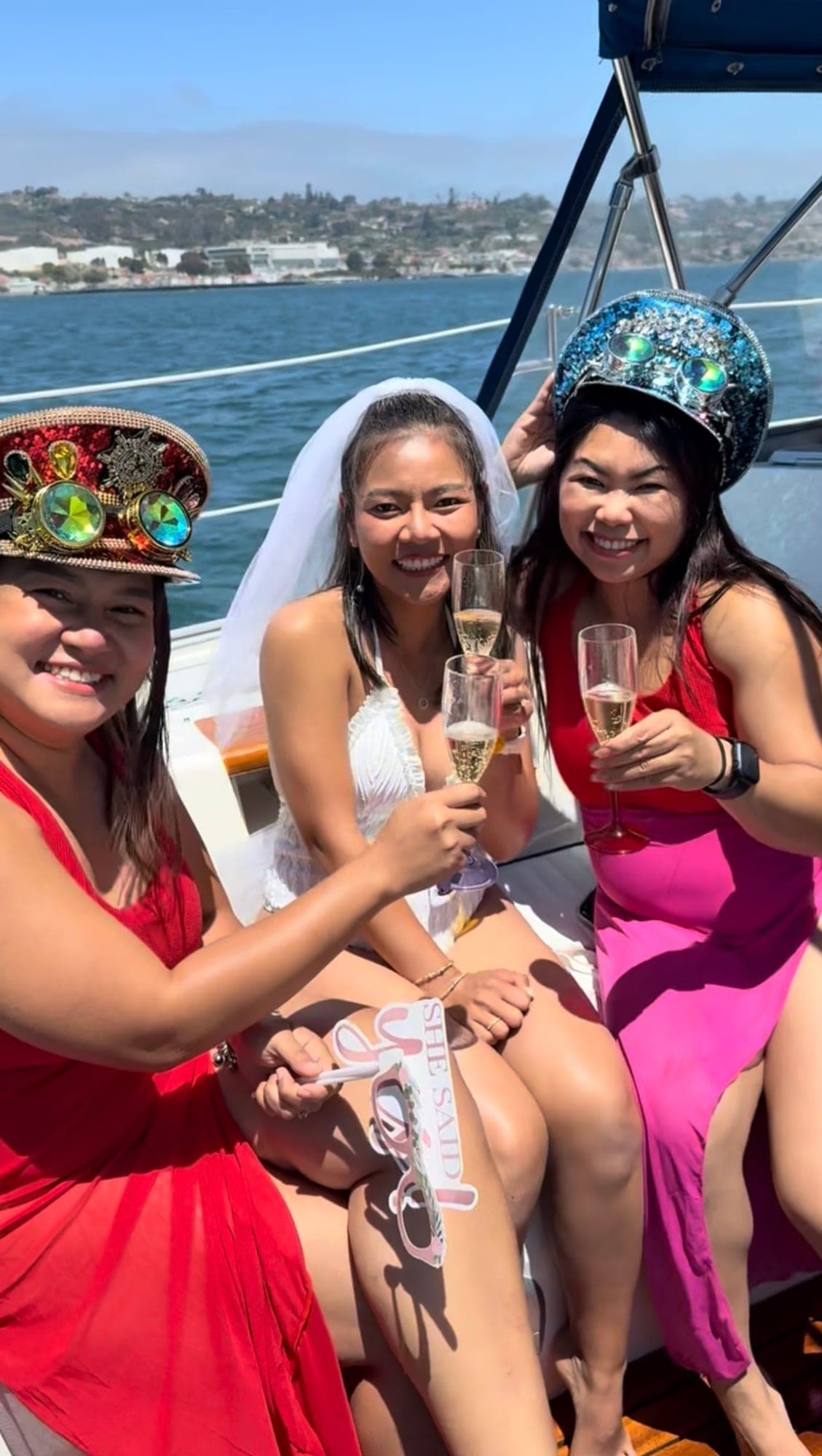 A bachelorette group toasting champagne with the bride aboard the Mojave