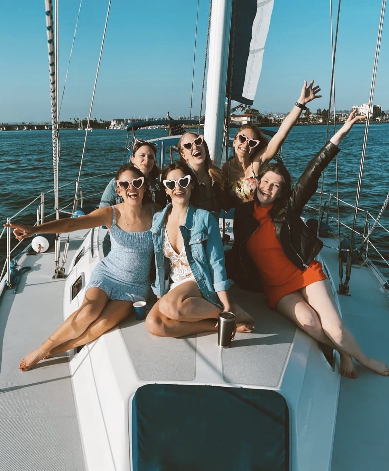 A bachelorette group at golden hour on deck in San Diego