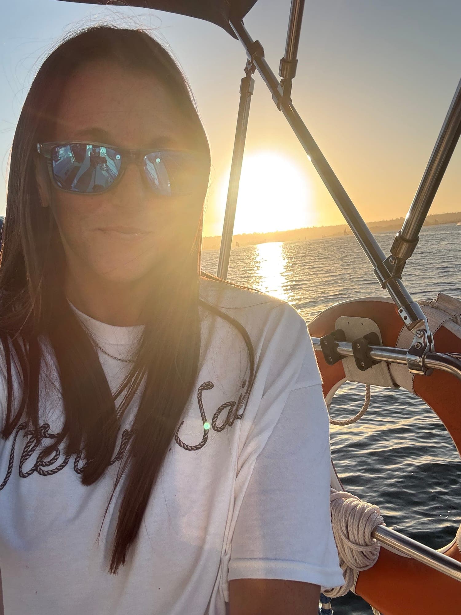 Captain Liz on deck aboard the Mojave at sunset on San Diego Bay