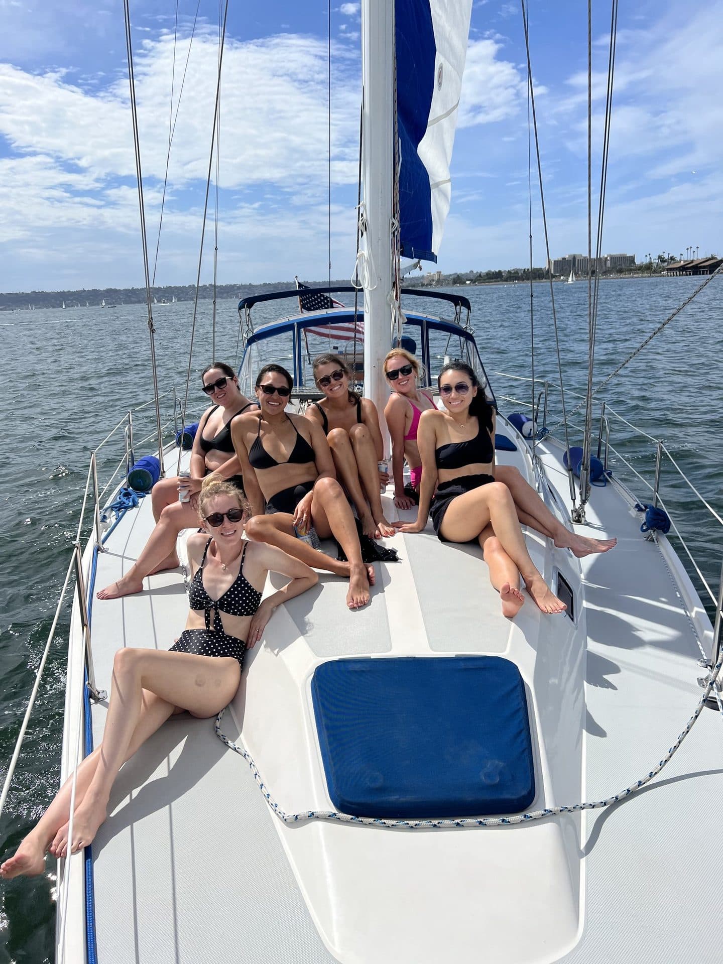 A group relaxing on deck during a Sail & Swim charter